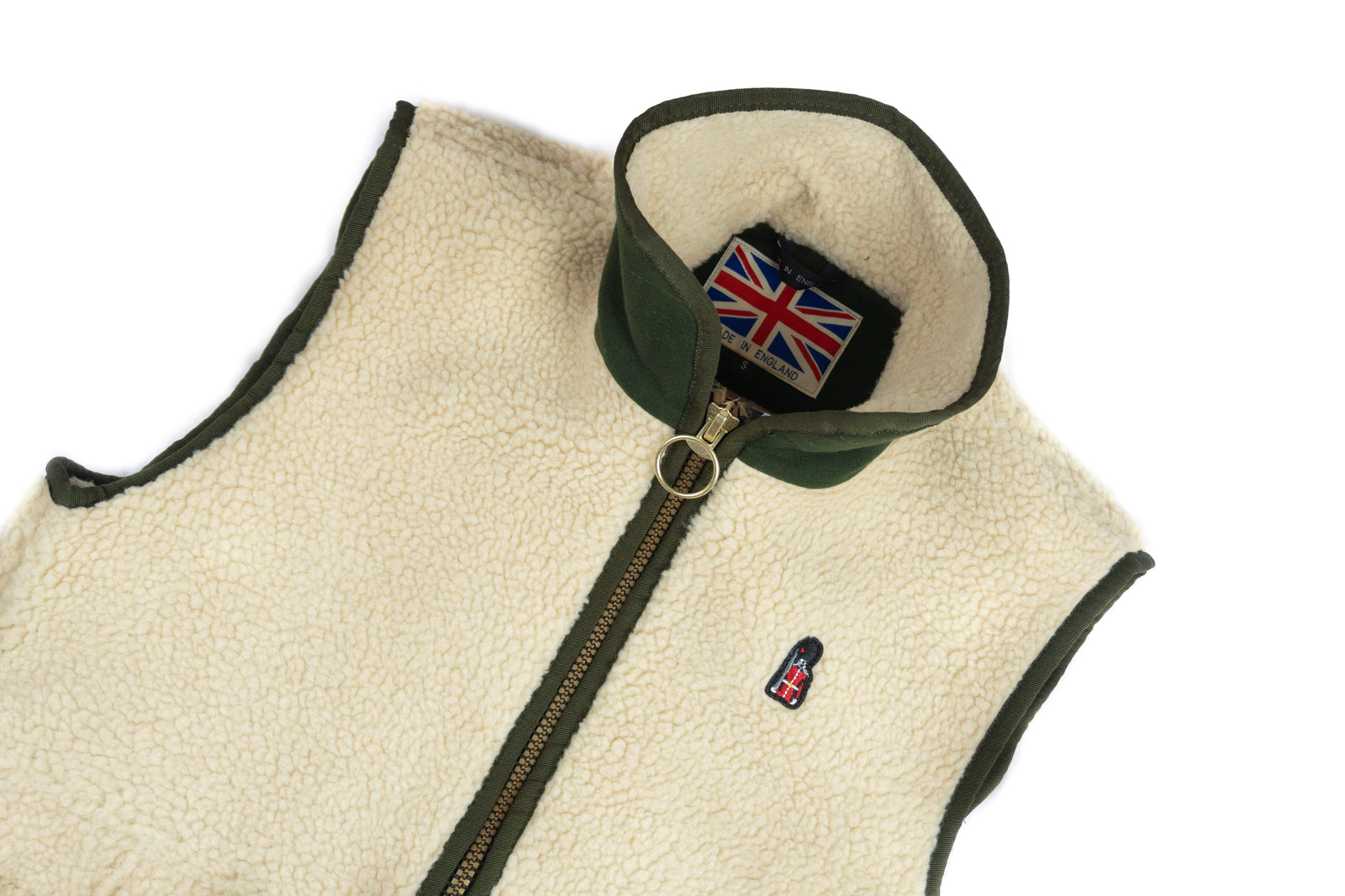 Beige fleece vest with green trim and a Union Jack logo on a white background