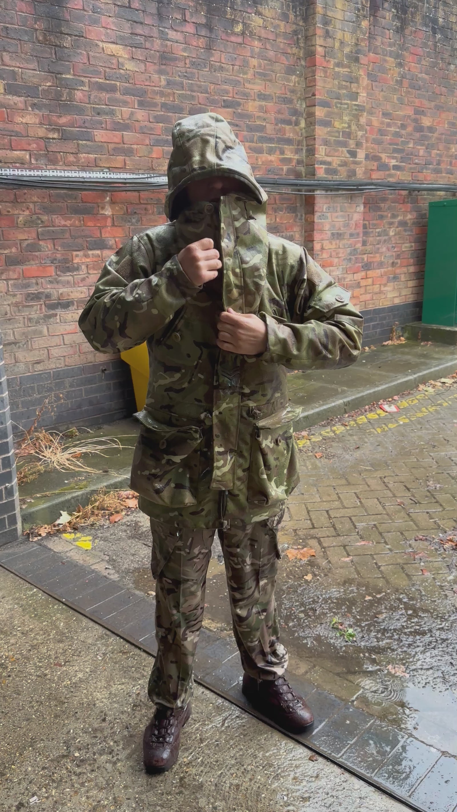 man showing that after being jet washed the smock kept him dry