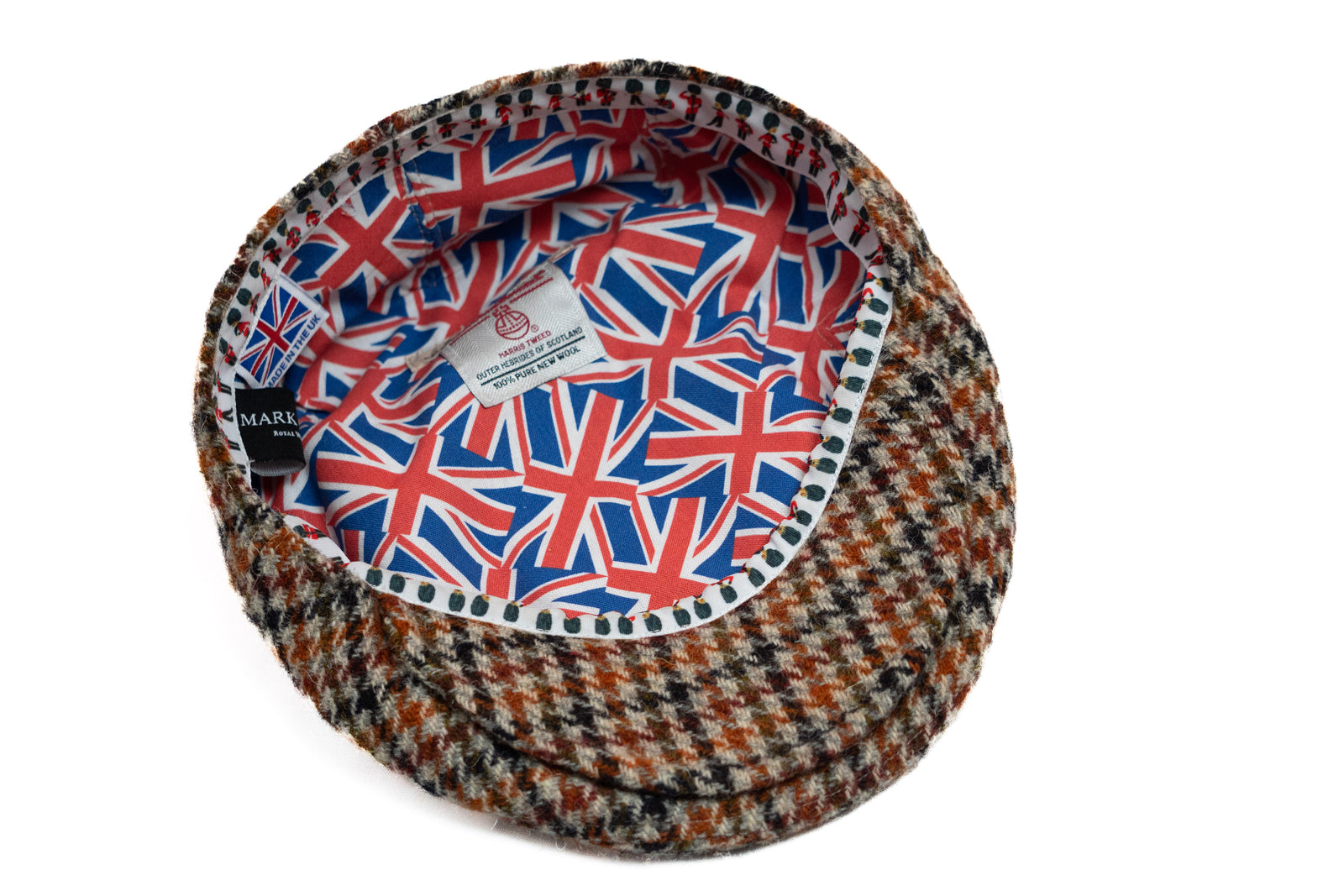 Houndstooth-patterned hat with Union Jack design on a white background