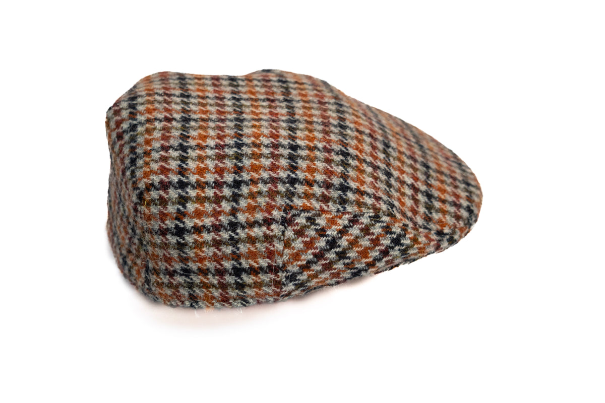Plaid flat cap on a white background